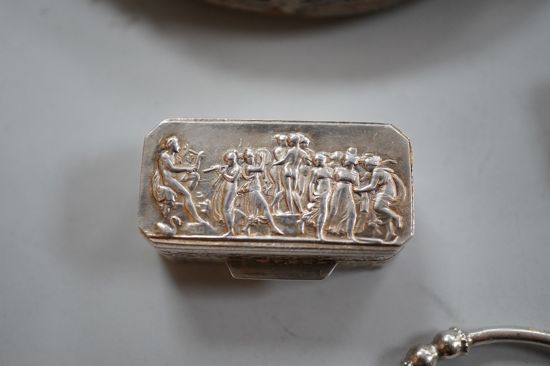 A small group of silver items including a William IV vinaigrette, William Simpson, Birmingham, 1835, 30mm, a later stamp case, two mounted photograph frames, two hinged bangles, together with a group of sterling or white